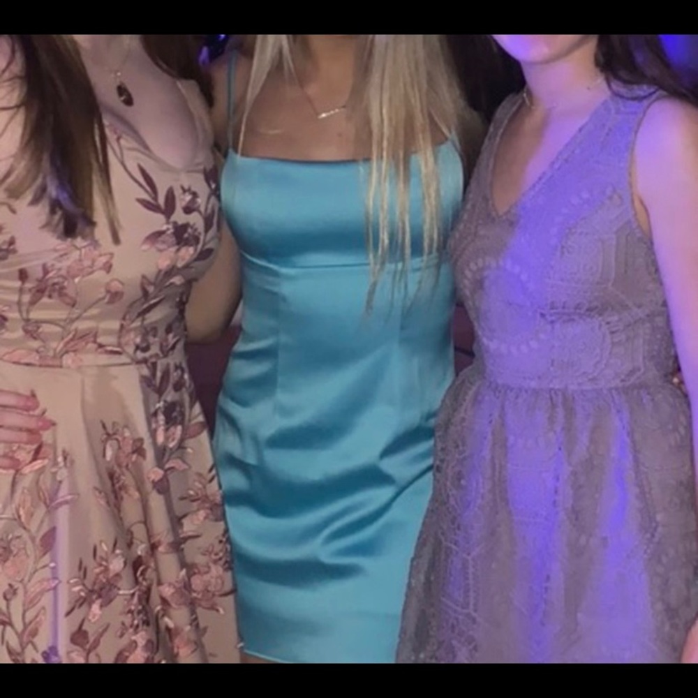 Lucy in the sky blue shiny dress.